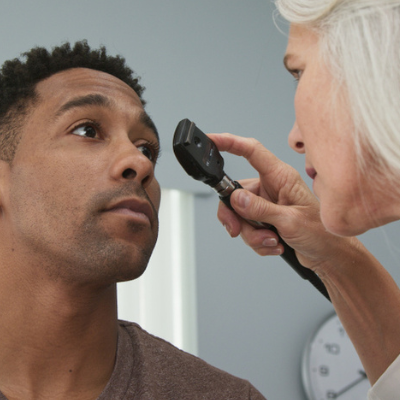 friendly-eye-doctor-examines-man-s-eyes-685345