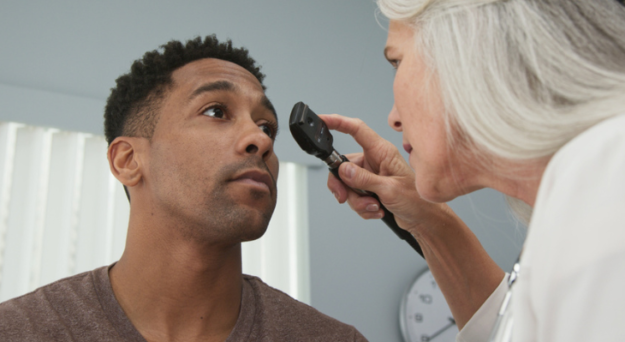 friendly-eye-doctor-examines-man-s-eyes-685345