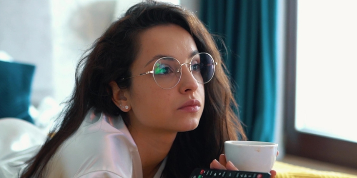woman-watches-television-while-modeling-glasses-693723